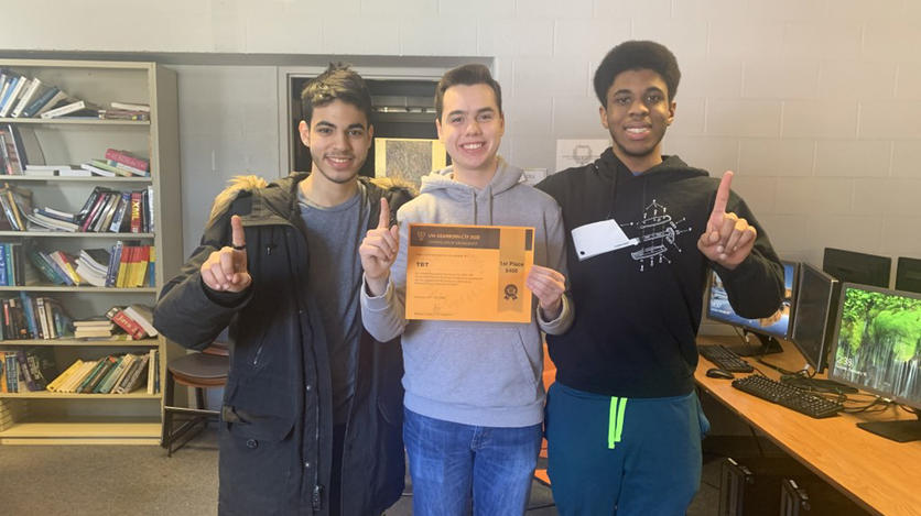 Eshete says their first Capture the Flag competition, which they hosted this past winter, was a huge success. Pictured here (left to right) are first place winners Hassan Ibrahim, Alexander Kostoff, and Trevor Johnson.
