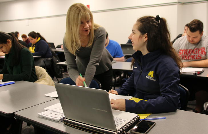 Lecturer Patty Graybeal talks to Brooke Spiegel about the study guide for next week's accounting test.