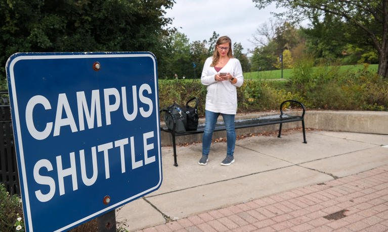 Heather waiting for the campus shuttle