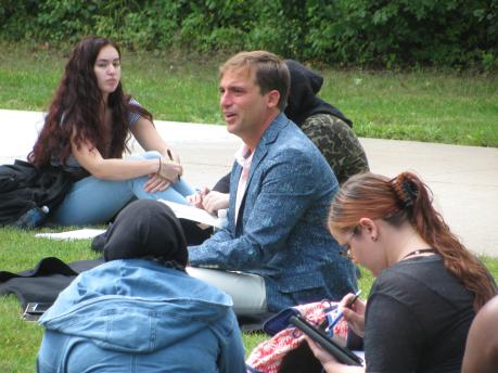 A class gathers on the lawn