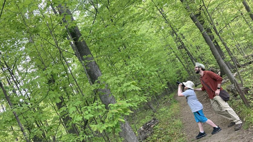 Guy Lenk, 2001 alumnus, and son Nolan on the trails looking for birds on May 15, 2021. They saw a heron fly overhead and were following the sounds of a Gray Catbird.
