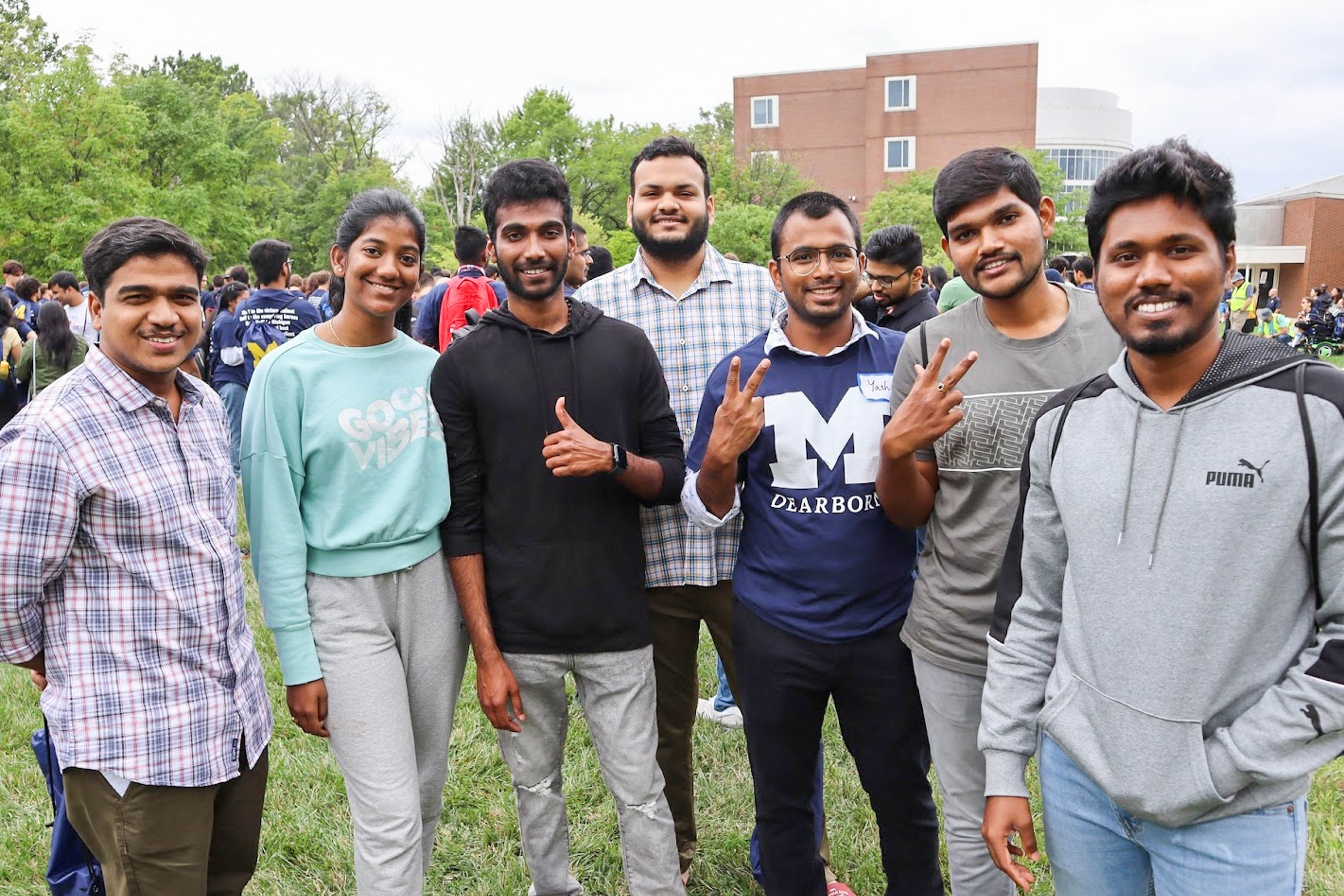 A group of international students pose for a photo on the UM-Dearborn campus during Wolverine Welcome Day in 2021.