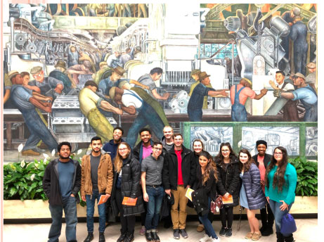 Students in front of Diego Rivera's mural at DIA museum