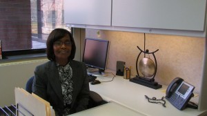 Anita Green sitting at desk