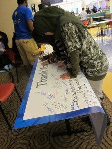 Students sign a banner during last year's appreciation week