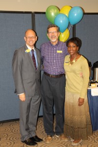 Christopher Tremblay and Monica Porter congratulate Vice Chancellor Stanley E. Henderson