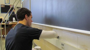 Students paint a classroom at Ann Visger Elementary School in River Rouge during Martin Luther King Jr. Day of Service 2012