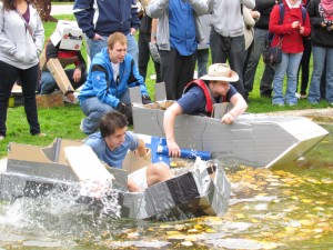 Student boat races in the Chancellor's Pond during Homecoming