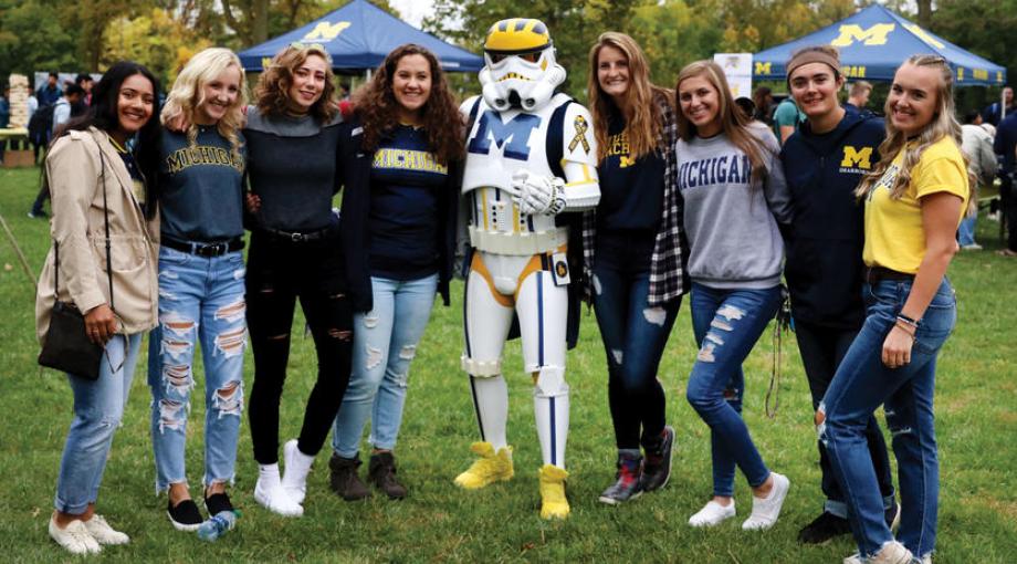 Wolverines enjoying music and games at the Homecoming Tailgate party.