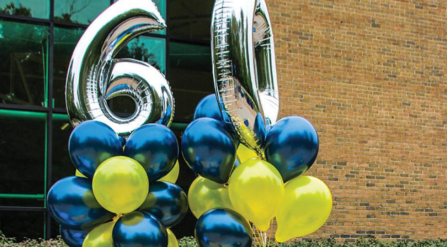 60 and maize and blue balloons