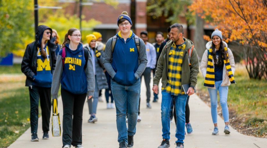 Students wearing UM-Dearborn gear on campus during Fall. 