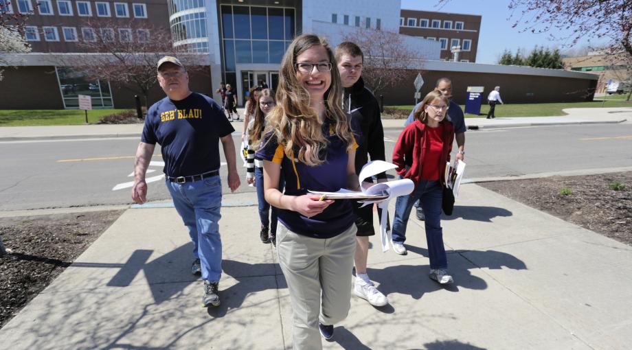 Student leading tour during Spring Open House event