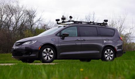 A gray minivan equipped with sensors attached to a rooftop rack. Photo courtesy Dataspeed