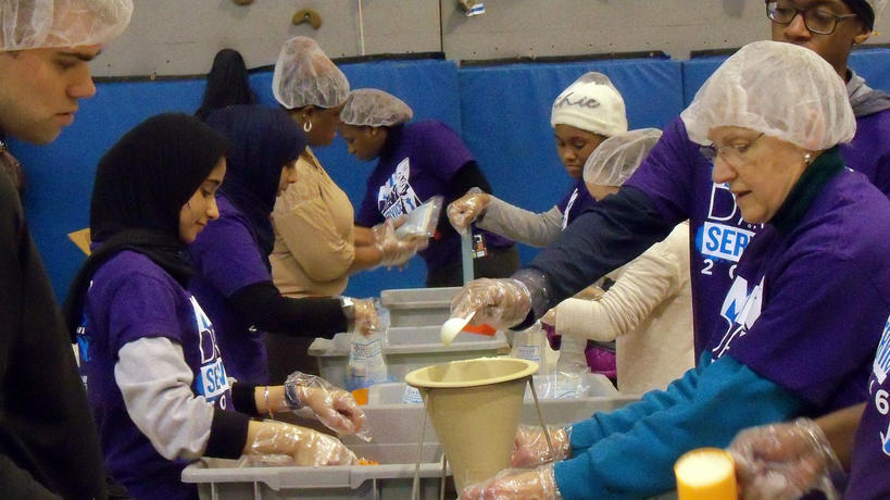 Volunteers creating food packages on MLK Day of Service.