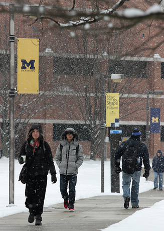 Students walking on campus outside in winter