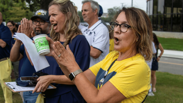 Provost and Executive Vice Chancellor for Academic Affairs Gabriella Scarlatta and Dean of Students Amy Finley cheer during Wolverine Welcome Day.