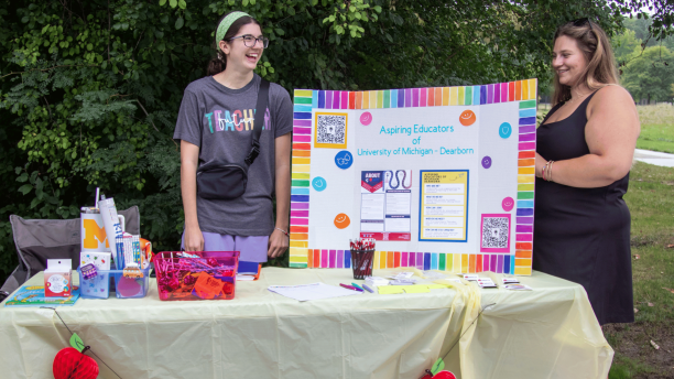 Students from the Aspiring Educators club host a booth at the Go Blue Bash.