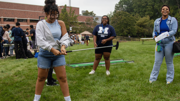 Students play mini golf at the Go Blue Bash