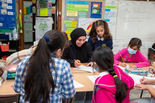 Student teacher working with students