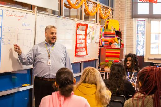 Teacher teaching high school students.