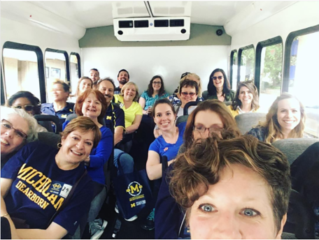 Staff photograph on bus trip posted on Instagram.