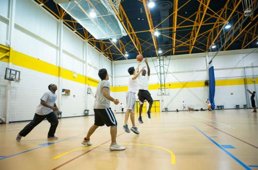 Students playing one player making a jump shot