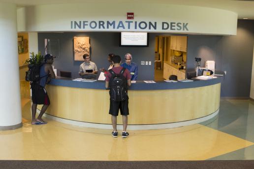 Students at the Information Desk at the James C. Renick University Center