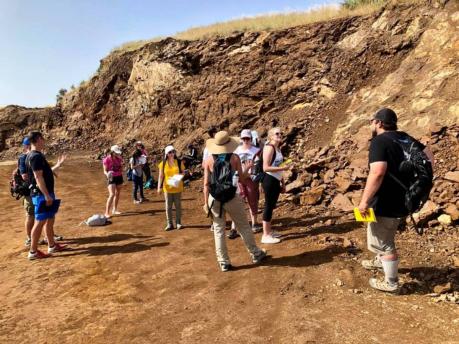Group of people exploring dirt hill in Cyprus