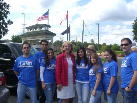 Group of interns with blue shirts in Lansing.