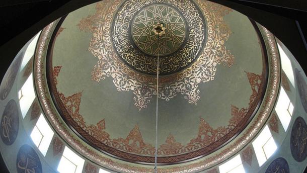 Looking up to an Islamic center dome