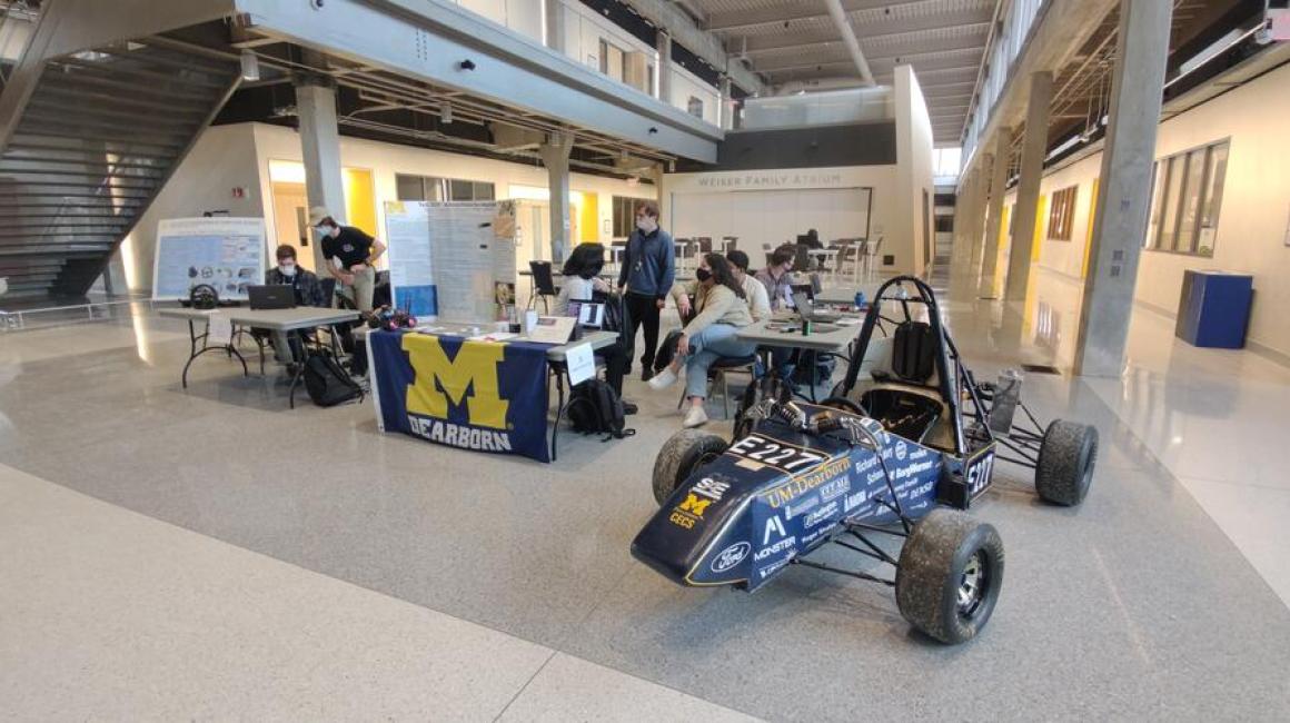 Students show off their Formula SAE car in the new ELB Atrium. Photo by Rudra Mehta