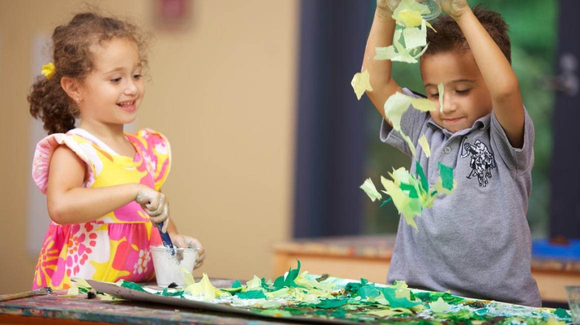 Two young children play during a preK class at the Early Childhood Education Center.