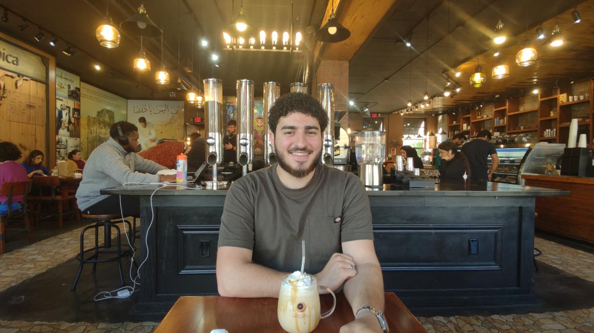 Senior Hussein Badran enjoys a drink at Qahweh House, one of his favorite coffee shops. Photo by Rudra Mehta