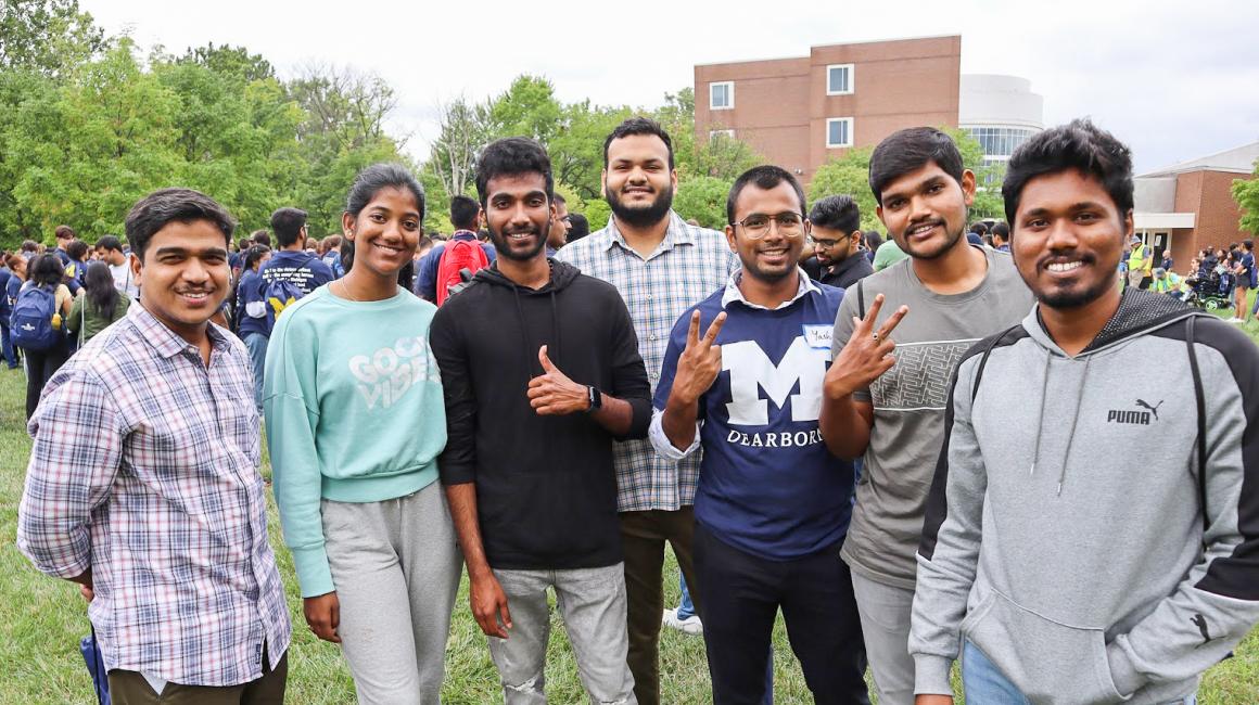 International students gather for a photo on the UM-Dearborn campus.