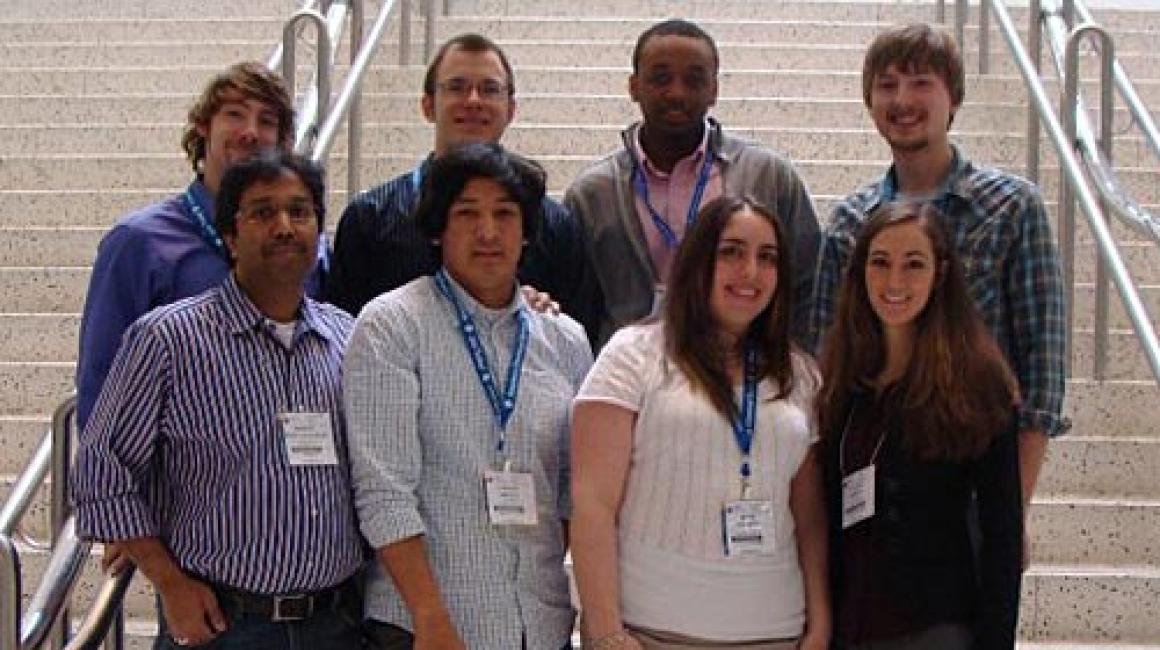 A group of 8 attendees, five men and two women, at the American Chemical Society meeting