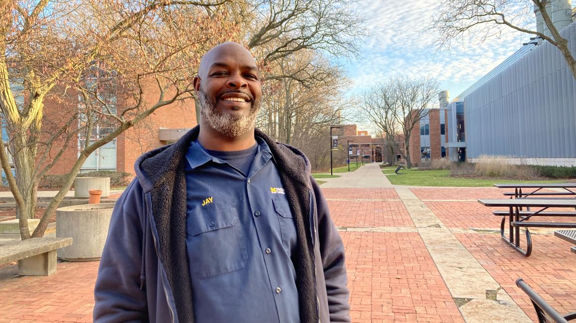 Custondian Jay Crofton poses for a photo on the UM-Dearborn campus in mid-winter