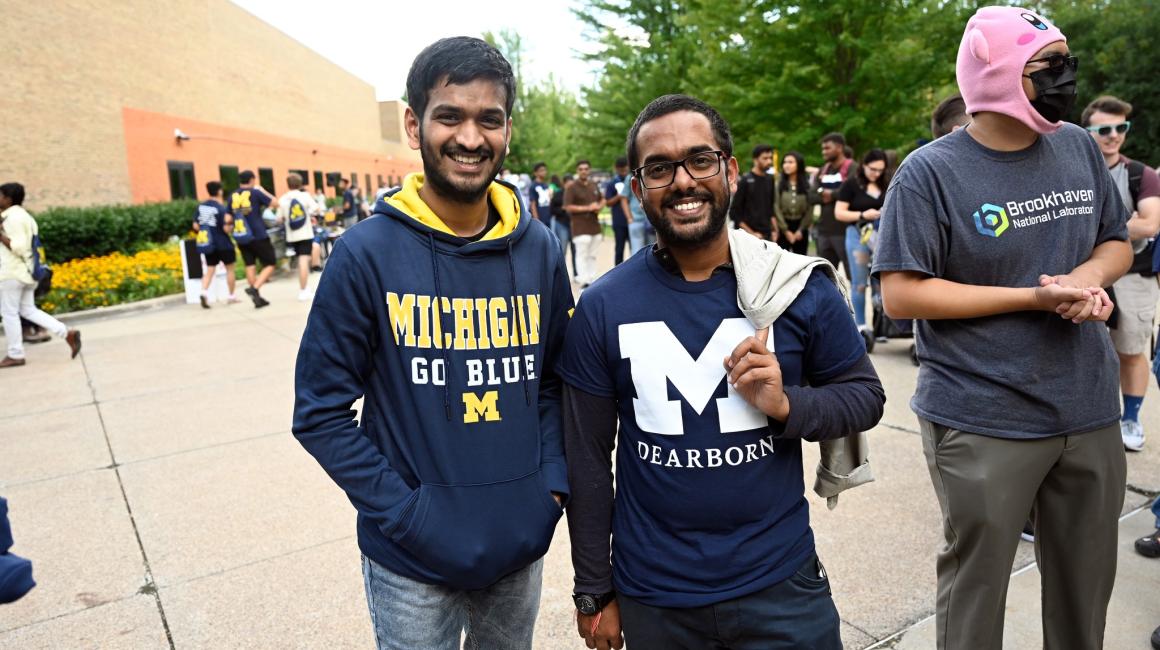 Two students pose for a photo at Wolverine Welcome Day in 2022.