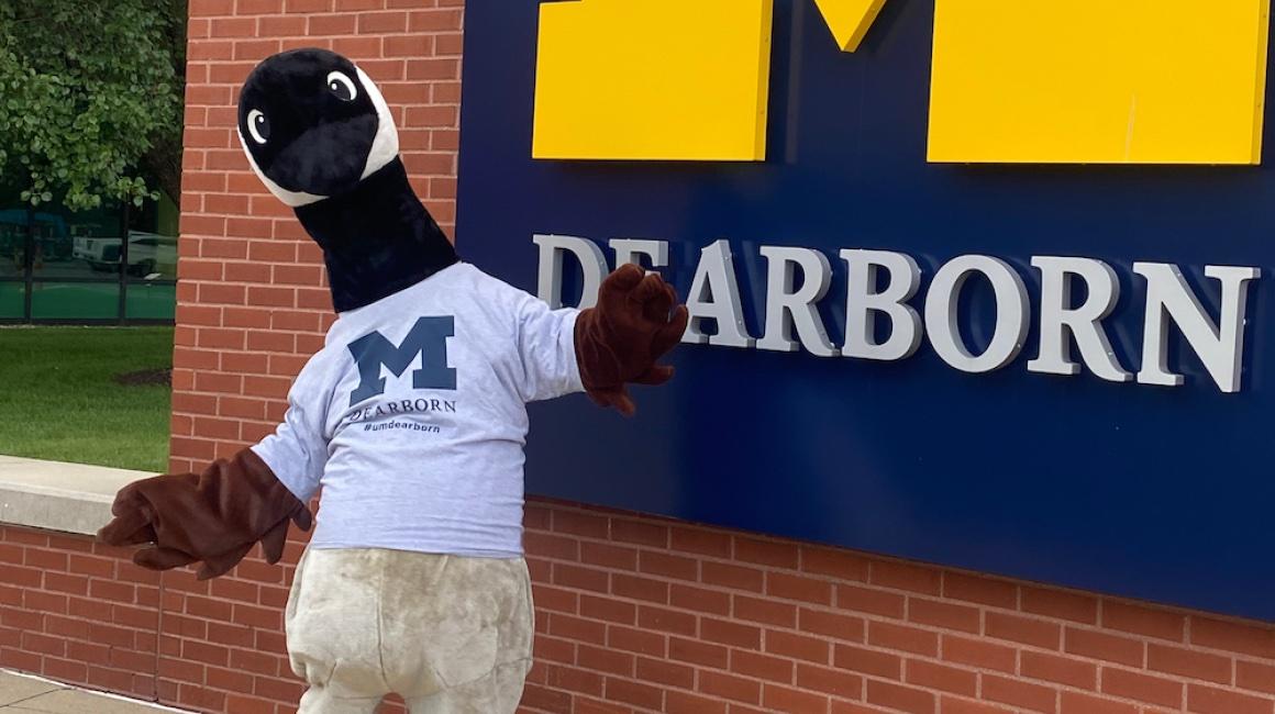 Bruce the Goose in front of Renick UC sign