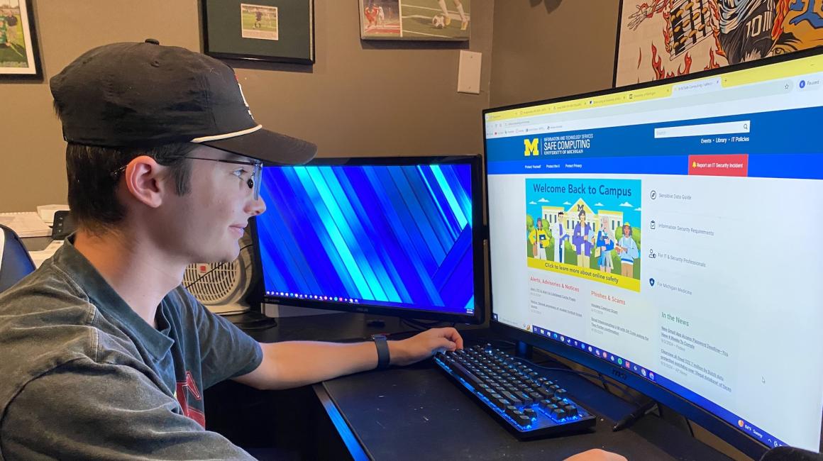 Photo of student Kyle Piestrak looking at the Safe Computing site