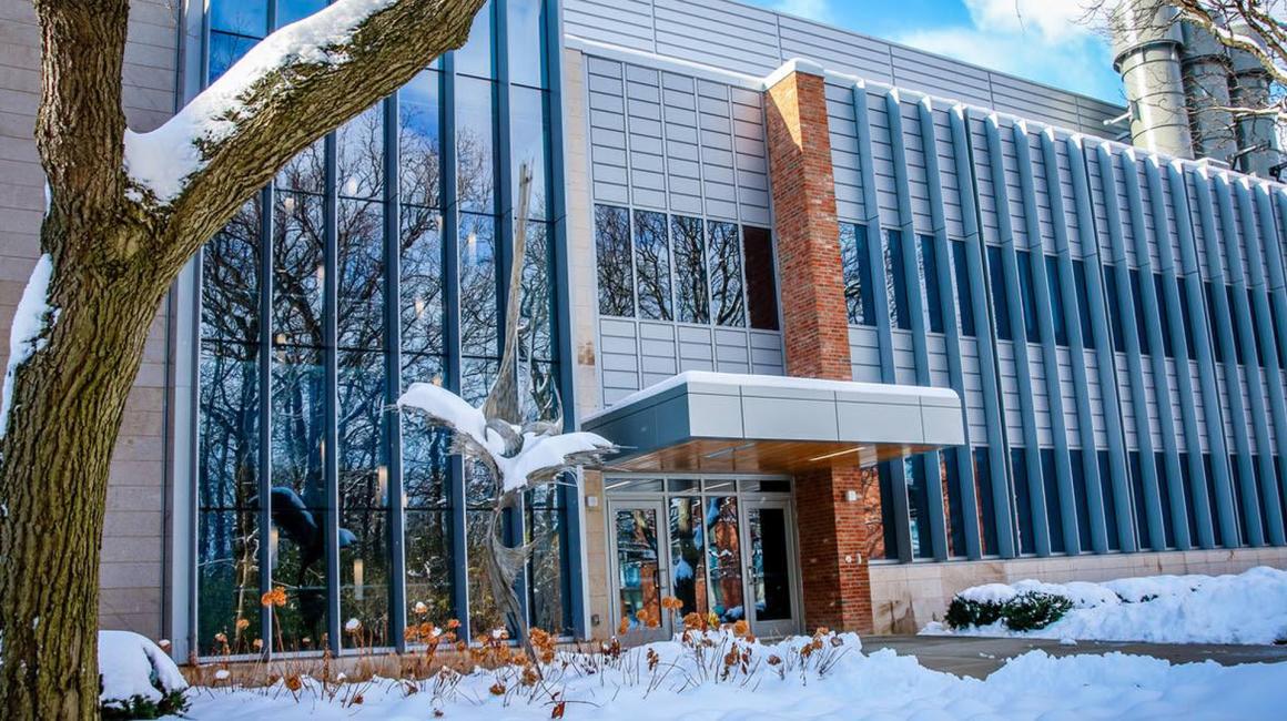 A photo of the snowy exterior of the Natural Sciences Building.