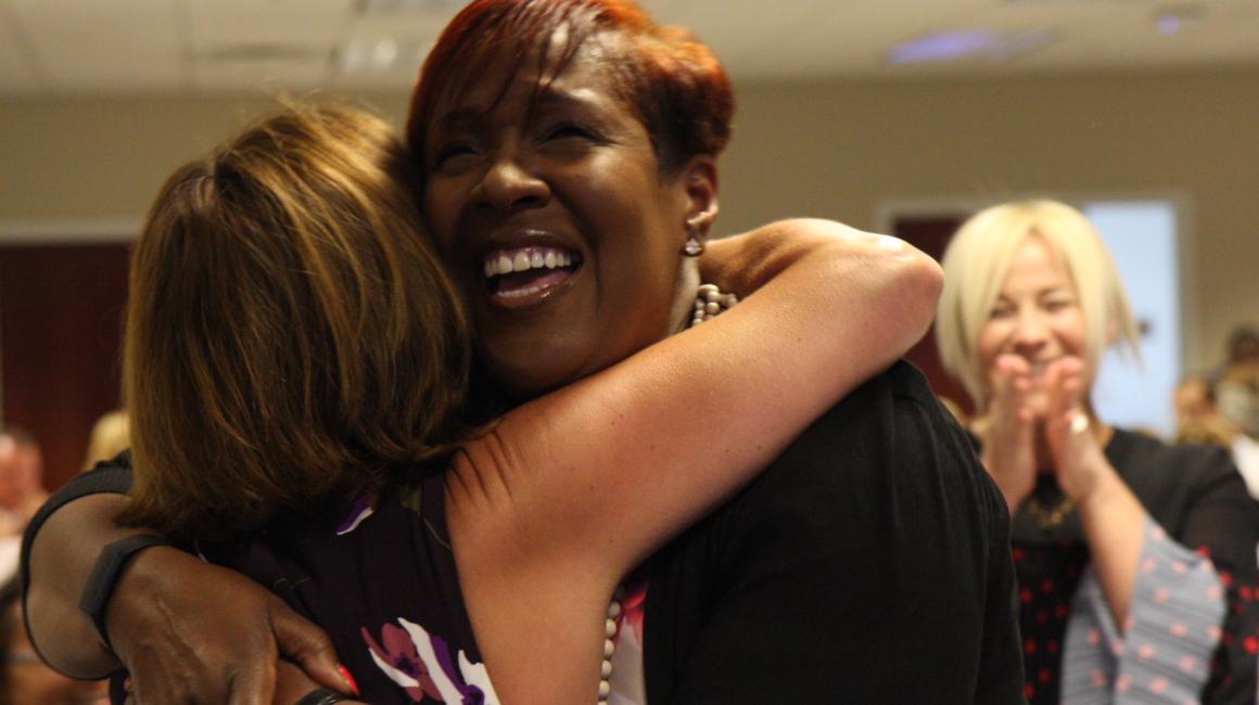 Renee Mainor hugging a woman during the Chancellor’s Staff Recognition Awards ceremony.
