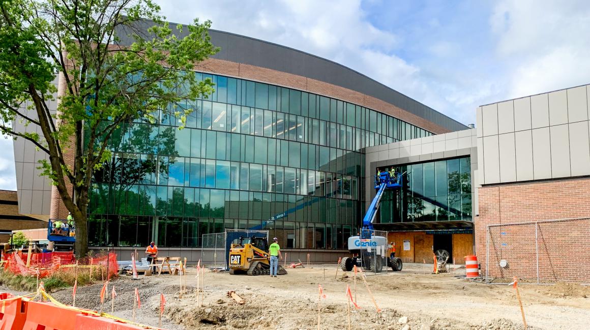 The front facade of the Engineering Lab Building with construction, machinery, and crew surrounding. 