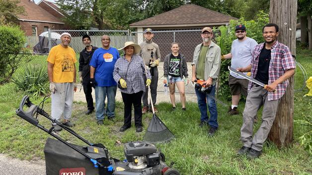 The Alley Activation team cleans up an alley in a Northwest Detroit neighborhood