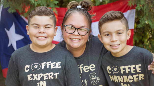 Business owner Ida Gonzalez, center, started a coffee company. She's pictured with her two children.