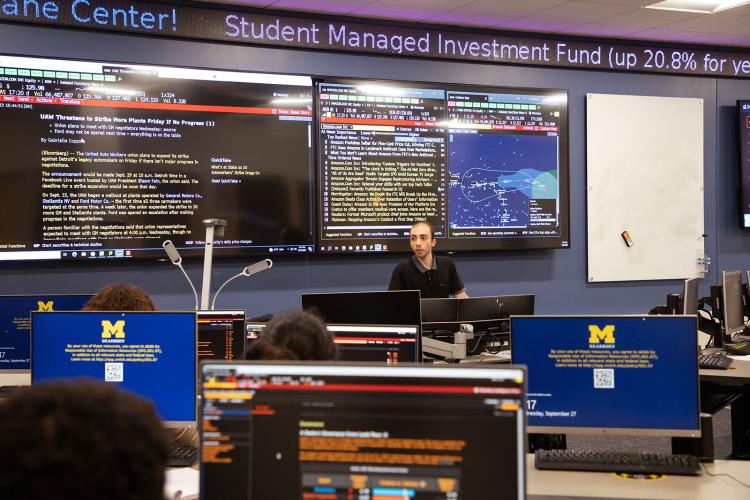 Teacher in class at the Bloomberg Finance Lab