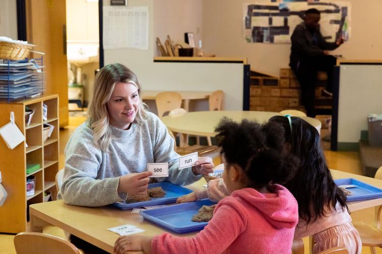 Early Childhood Teacher with students at ECEC