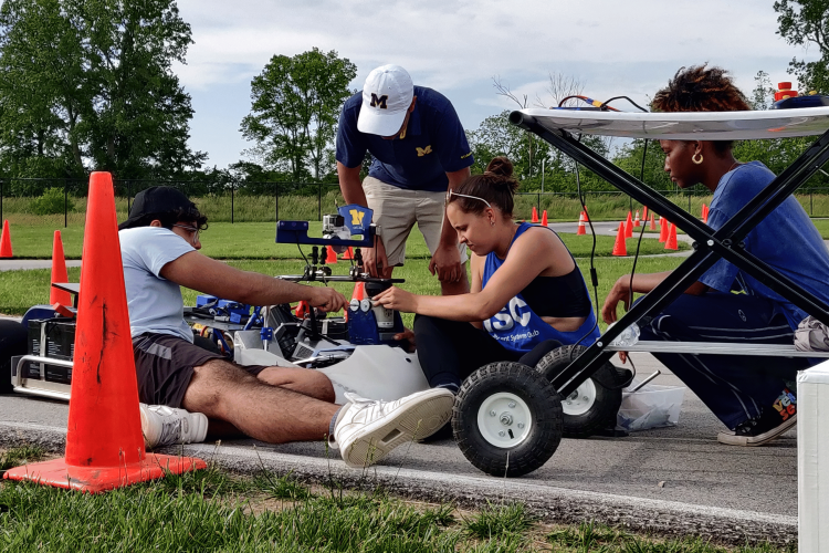 Intelligent System Club members work on the go-kart leading up to competition. 