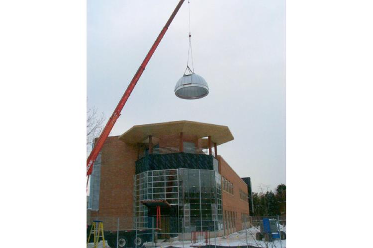 Construction of the Observatory dome being lowered into place