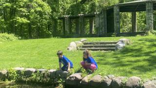 2002 alum Phil Tuxbury's children, Ronen (7) and Rebekah Tuxbury (8), looking at the former rose garden on the EIC land in May 2024