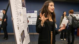 CEHHS student Sofia Martínez Barredo presents her research findings during the 2024 Summer Undergraduate Research Experience showcase on Sept. 17. 